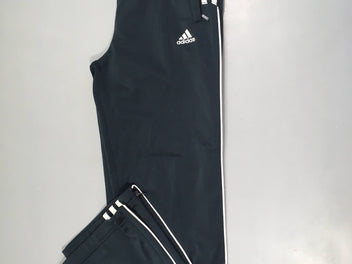 Pantalon de training bleu foncé, légèrement bouloché