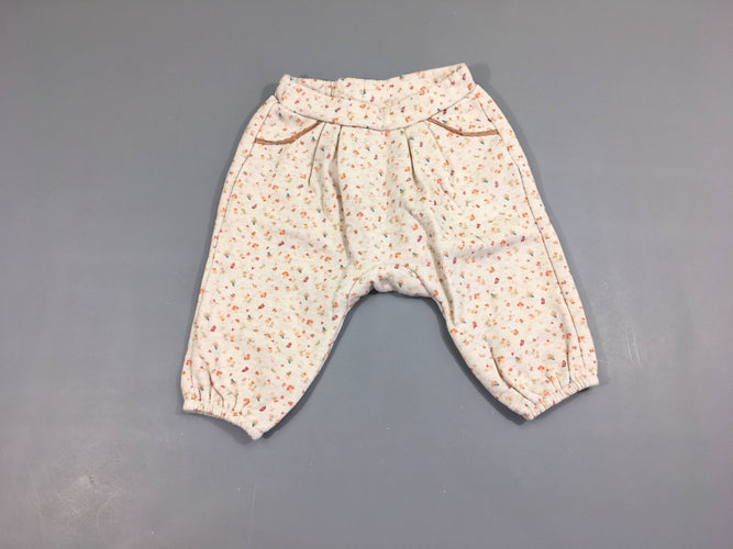 Pantalon molleton beige petits motifs orangés, moins cher chez Petit Kiwi