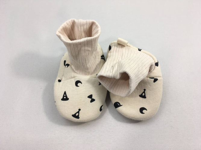 Chaussons textiles beige motifs noirs, moins cher chez Petit Kiwi