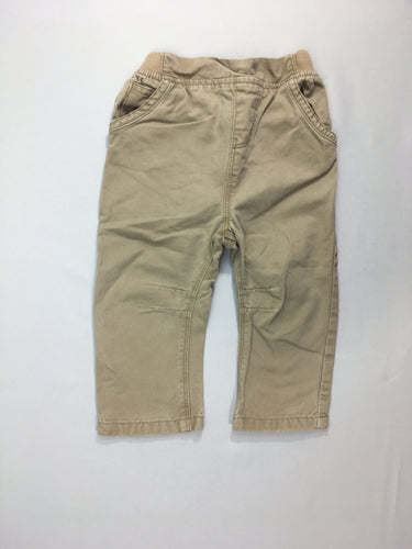 Pantalon beige sarouel, légèrement bouloché, moins cher chez Petit Kiwi