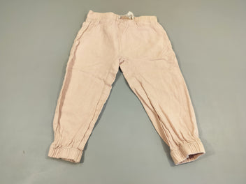 Pantalon rose clair taille et chevilles élastiques, très légèrement bouloché