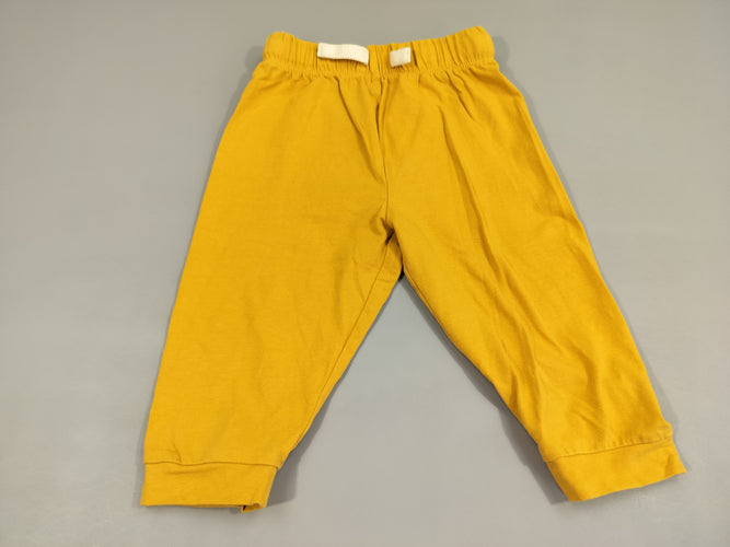 Pantalon jersey jaune, arrière tête de lion . Légère tache sur le dessous, moins cher chez Petit Kiwi