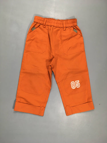 Pantalon orange, 2 poches à l'arrière. 100% polyester, moins cher chez Petit Kiwi